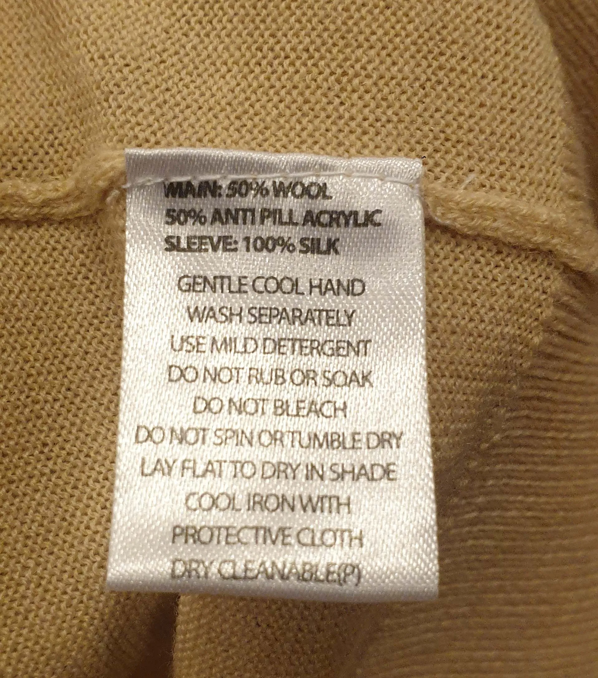 Alpha 60 light beige wool mix knit with 100% silk sleeves size XS, best fits size 8